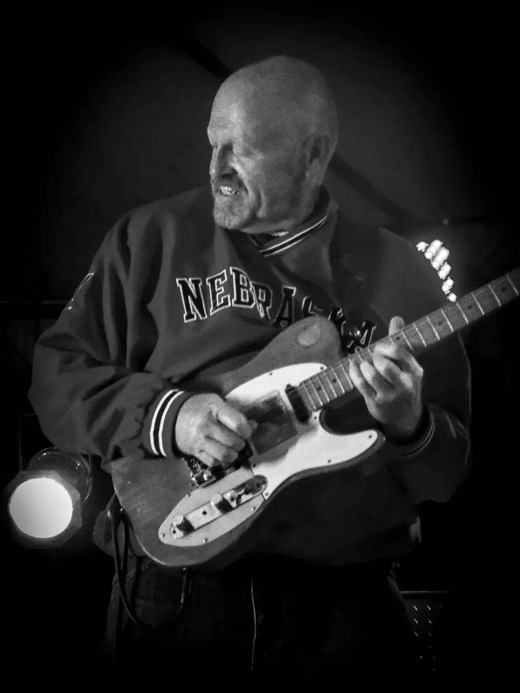 Reuben Adkins - artistic black and white portrait with guitar